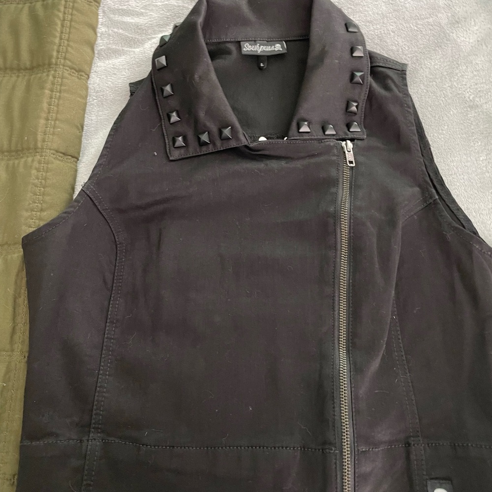 Black studded vest.